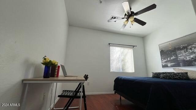 bedroom featuring dark wood-type flooring