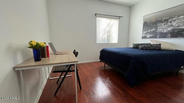 bedroom featuring dark hardwood / wood-style floors