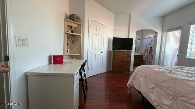 bedroom featuring dark wood-type flooring