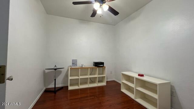 interior space featuring ceiling fan and dark hardwood / wood-style flooring