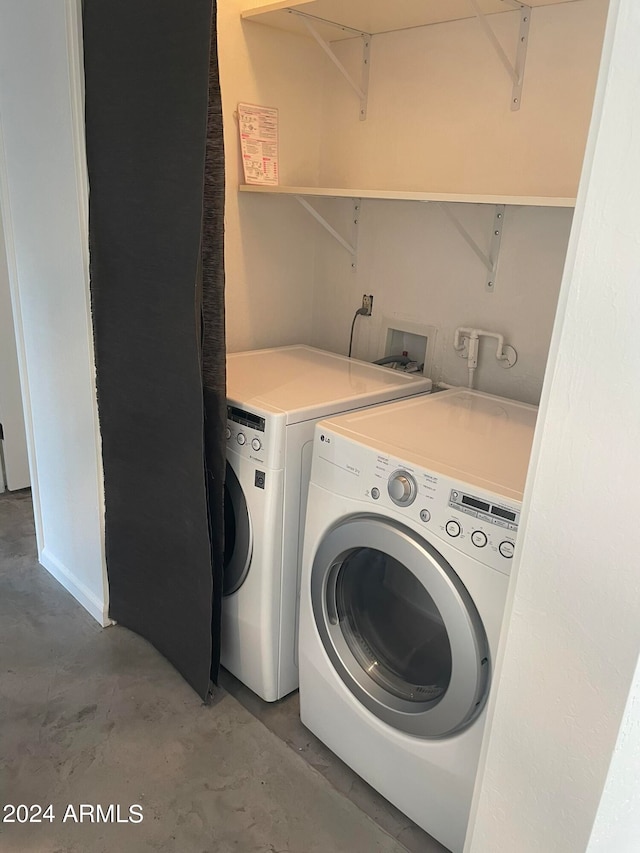 washroom with washer and dryer