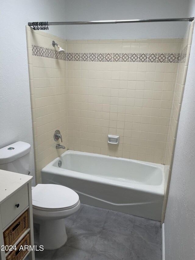 full bathroom with vanity, toilet, and tiled shower / bath combo