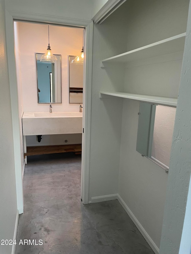 interior space featuring concrete floors and vanity