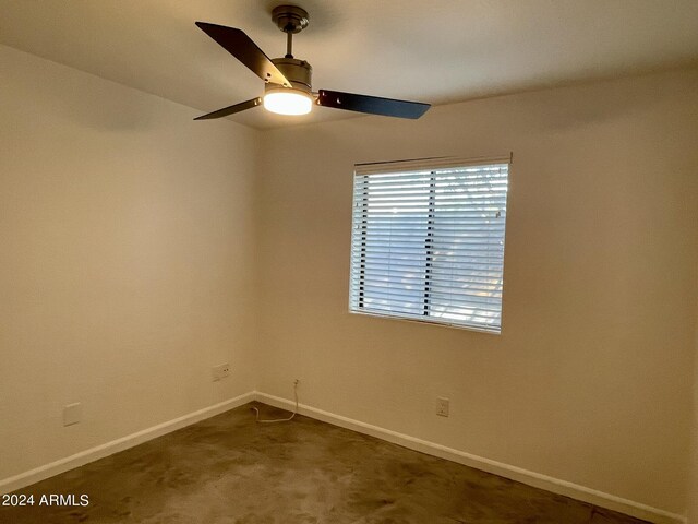 empty room featuring carpet flooring and ceiling fan