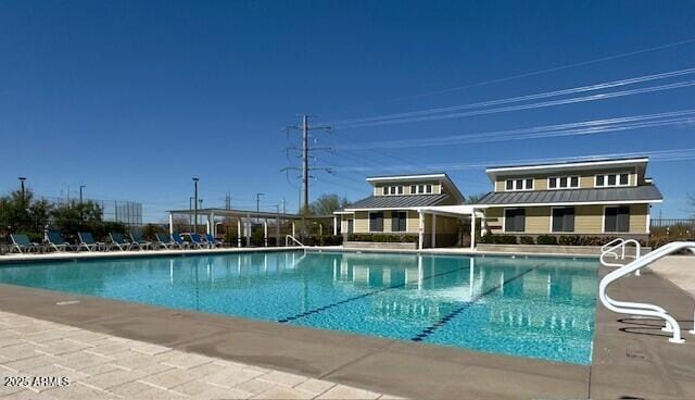 community pool featuring a patio area