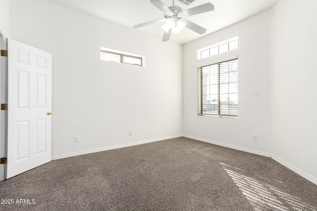 empty room featuring carpet floors and ceiling fan