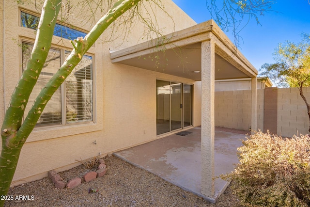 back of property featuring a patio