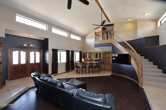 11215 N Garland Cir, Fountain Hills, AZ 85268 - living area featuring stairs, high vaulted ceiling, wood finished floors, and ceiling fan with notable chandelier
