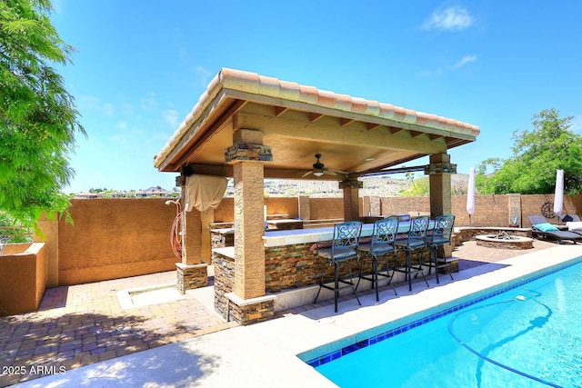 11215 N Garland Cir, Fountain Hills, AZ 85268 - view of swimming pool featuring a patio area, outdoor dry bar, a gazebo, a fenced backyard, and an outdoor fire pit