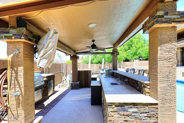 11215 N Garland Cir, Fountain Hills, AZ 85268 - view of patio / terrace featuring a fenced backyard, ceiling fan, a grill, and exterior kitchen