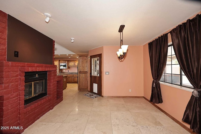 11215 N Garland Cir, Fountain Hills, AZ 85268 - unfurnished dining area featuring baseboards, recessed lighting, a brick fireplace, and a healthy amount of sunlight