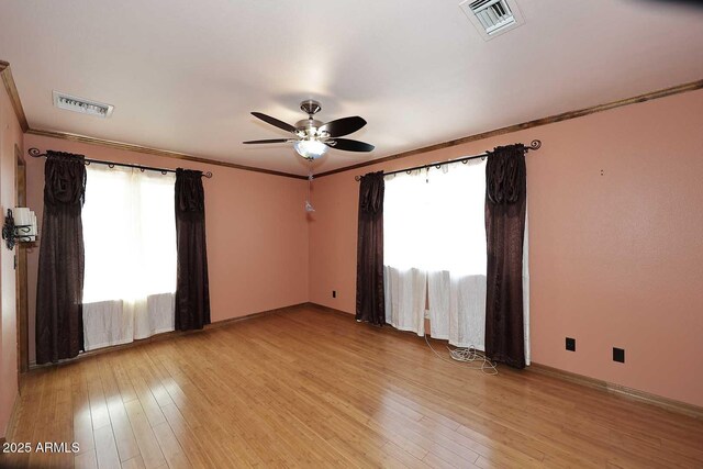 11215 N Garland Cir, Fountain Hills, AZ 85268 - empty room with a ceiling fan, visible vents, and a healthy amount of sunlight