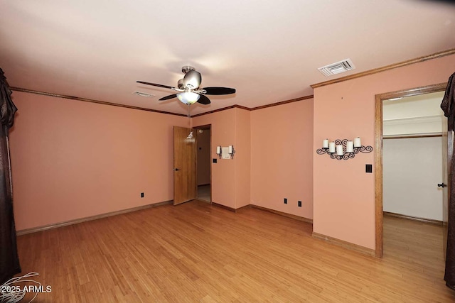 11215 N Garland Cir, Fountain Hills, AZ 85268 - empty room with ceiling fan, visible vents, crown molding, baseboards, and light wood-style flooring