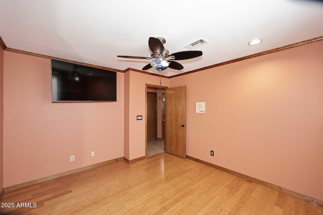11215 N Garland Cir, Fountain Hills, AZ 85268 - unfurnished room featuring a ceiling fan, visible vents, crown molding, baseboards, and light wood-style flooring