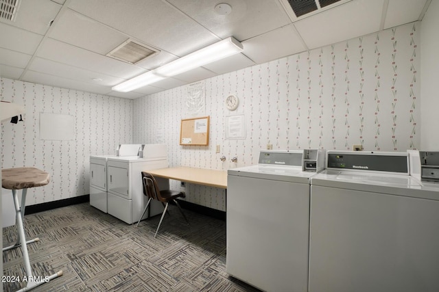 clothes washing area featuring separate washer and dryer