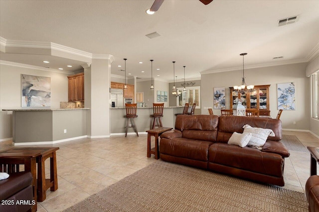 tiled living room featuring ornamental molding and ceiling fan with notable chandelier