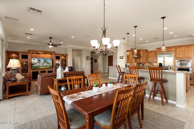 dining room with crown molding, ceiling fan, and light tile patterned floors