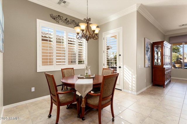 dining room with an inviting chandelier, light tile patterned floors, and ornamental molding