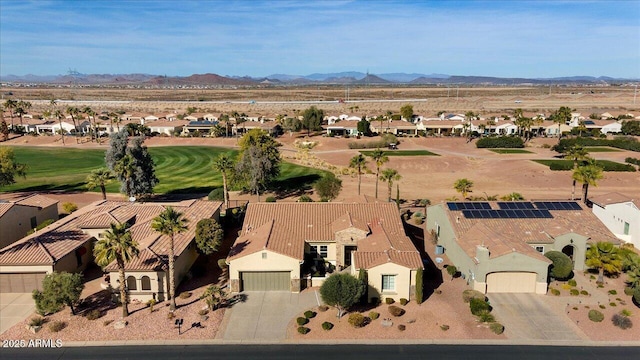 birds eye view of property with a mountain view