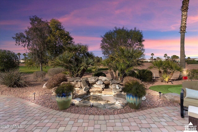 view of patio terrace at dusk