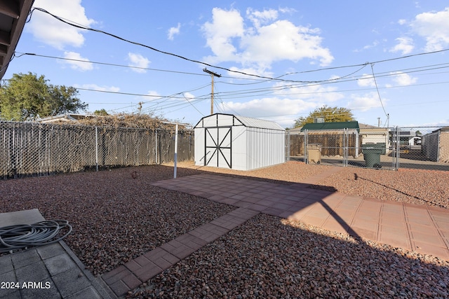 view of yard with a patio area and a shed