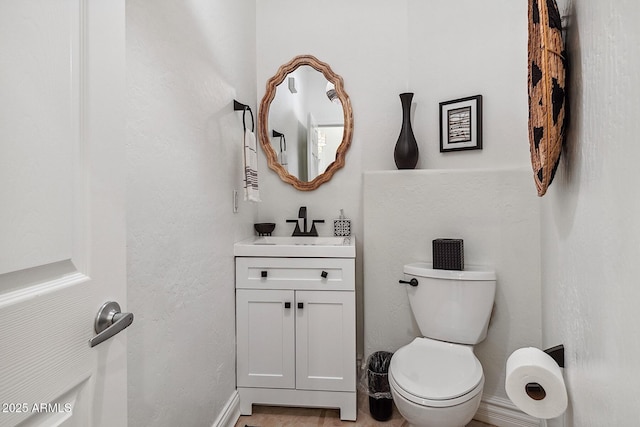 half bath with toilet and vanity