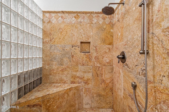 bathroom with tiled shower