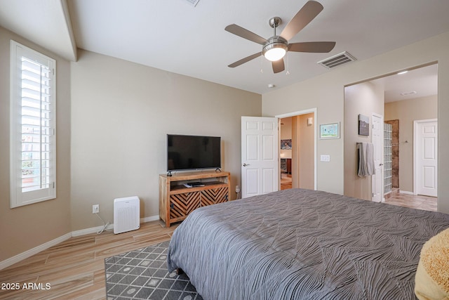 bedroom with hardwood / wood-style flooring and ceiling fan