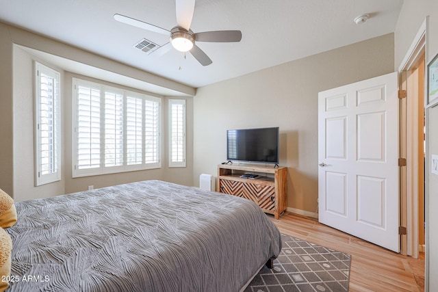 bedroom featuring hardwood / wood-style flooring and ceiling fan