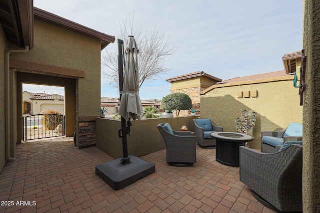 view of patio with an outdoor fire pit