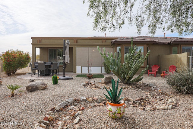 rear view of property featuring a patio