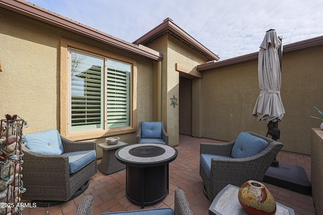 view of patio / terrace with an outdoor fire pit