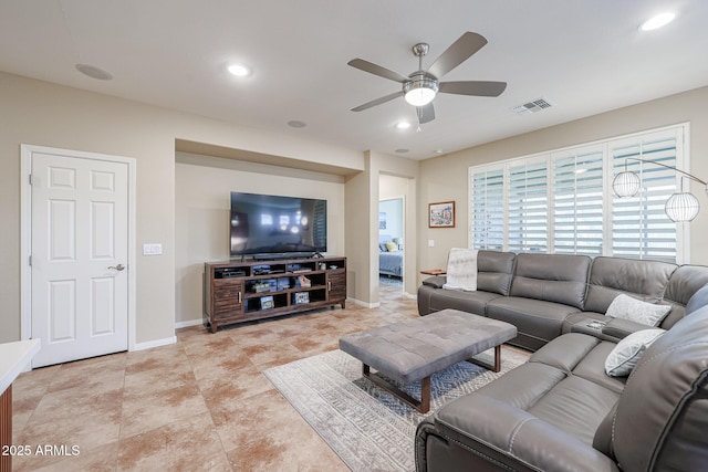 living room with ceiling fan and light tile patterned floors