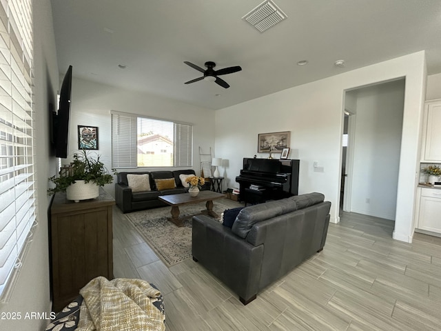 living room featuring ceiling fan