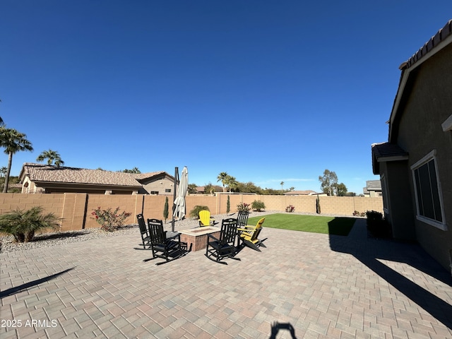 view of patio featuring a fire pit