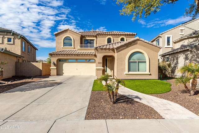 mediterranean / spanish-style house with a garage