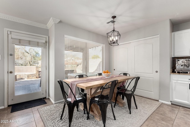 dining space with plenty of natural light, light tile patterned floors, and an inviting chandelier