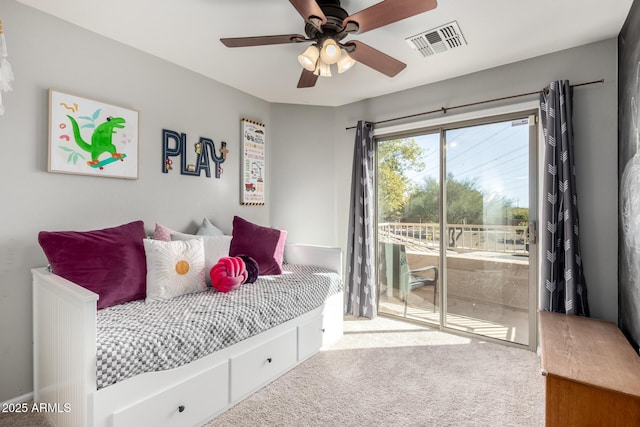 carpeted bedroom featuring access to exterior and ceiling fan