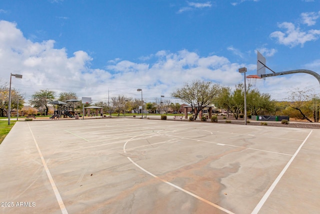 view of sport court with a playground