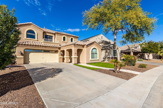 mediterranean / spanish house featuring a garage