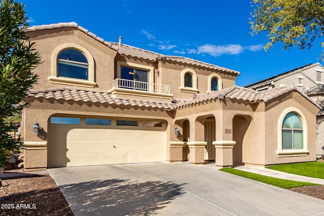 mediterranean / spanish house featuring a garage