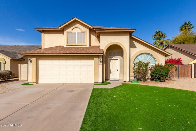 view of front of home with a front yard and a garage