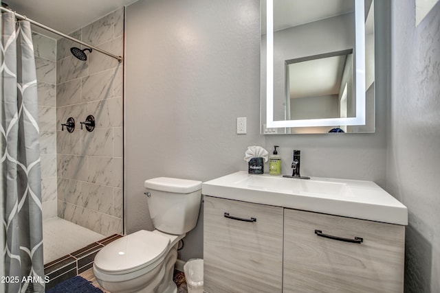 bathroom with vanity, a shower with curtain, and toilet