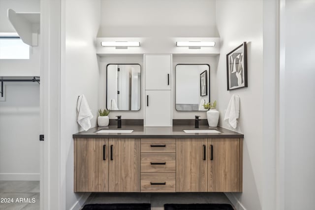 bathroom with vanity, toilet, a stall shower, and ceiling fan