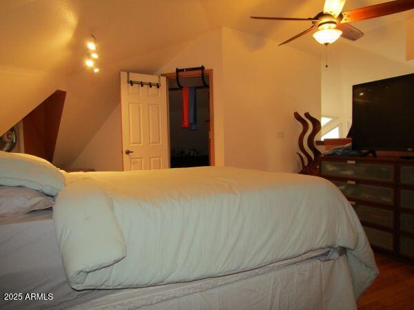 474 N Meadow Way, Payson, AZ 85541 - bedroom with lofted ceiling and wood finished floors