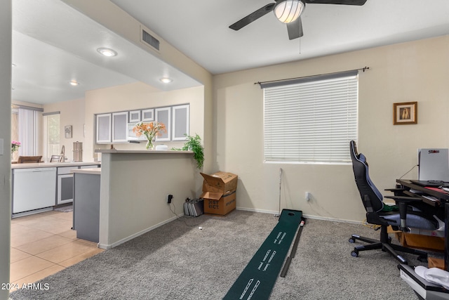 carpeted office space with ceiling fan and sink