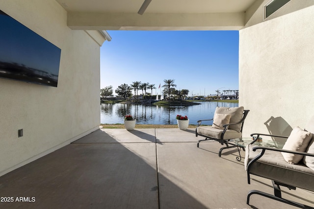 view of patio with a water view