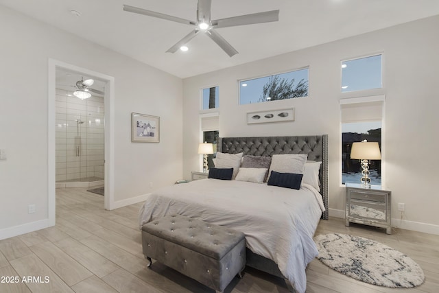 bedroom with light wood-type flooring, connected bathroom, a ceiling fan, and baseboards