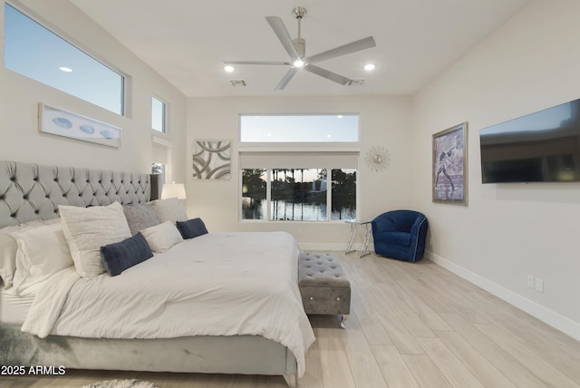 bedroom with recessed lighting, light wood-type flooring, visible vents, and baseboards