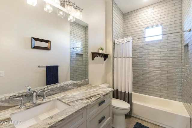 bathroom featuring shower / tub combo with curtain, vanity, and toilet